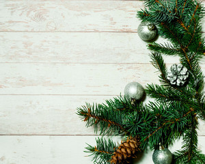 Fototapeta na wymiar Christmas decor. Festive light background with fir branches and cones, top view, the concept of the New Year holidays, close up, copy space