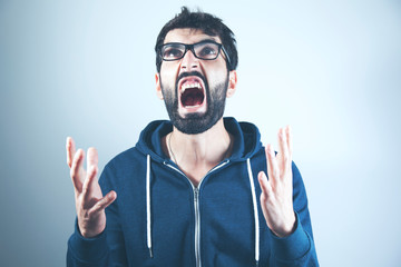 Angry man in gray background
