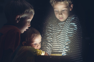 Retro image of holiday magic with three toddler kids © Gajus