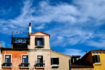 Fototapeta na wymiar Rooftops and blue skies