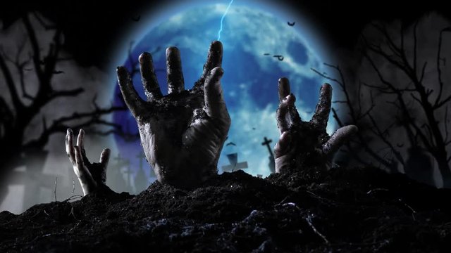 Blue moon shines lightning flashes and slowly a few human hand emerges from the earth.