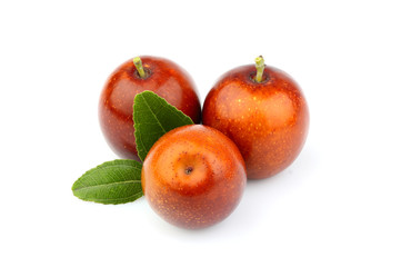Ripe Jujube (Ziziphus) fruits with leaves closeup.