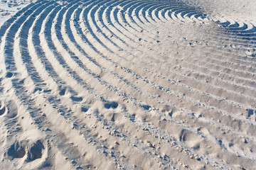 Fototapeta na wymiar large abstract circles in the sand, background, texture