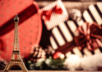 photo of the eiffel tower shaped toy on the christmas decorations background