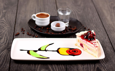 A cute tulip cake with Turkish coffee in the background
