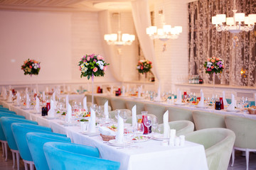 Birthday party concept. Flowers and tables in restaurant