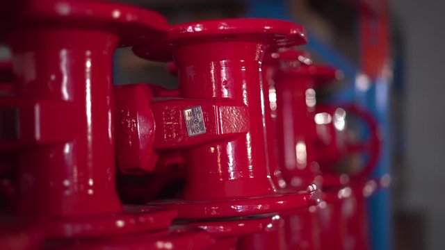 Stock holding of fire suppression steel water pipe valves in a storeroom.