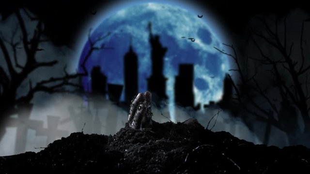 Human hand slowly crawls out of the ground. Smoky background