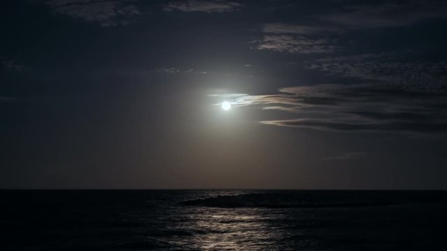 Time lapse of moon rising in the Aegean Sea at Lavrio, Greece.