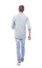 Fototapeta premium rear view. young man in jeans looking at copy space