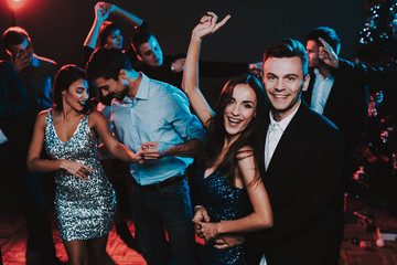 Happy Young People Dancing on New Year Party.