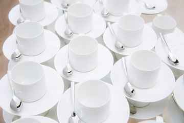 stacked white cup with a spoon