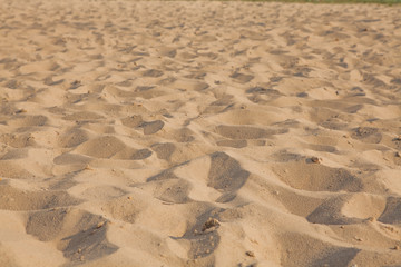 Closeup of sand pattern of a beach in the summer. Background.concept for summer season