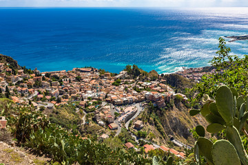Naklejka na ściany i meble The view from the small village Castelmola at mountain top above Taormina, with the view of Mediterranean Sea and the skyline of Taormina.
