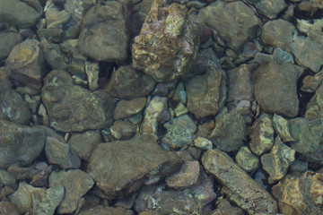 sea surface underwater fuzzy stones wallpaper concept shot idea for vacation, summer and rest theme, copy space 