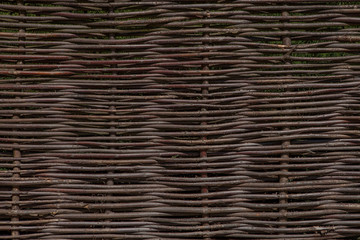 Wooden brown texture of thin rural fence rods