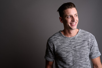 Portrait of happy young handsome man smiling