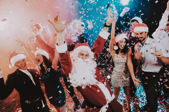 Man in Santa Claus Costume on New Year Party.