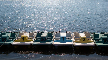 Colorful pedal boats on the lake - Powered by Adobe
