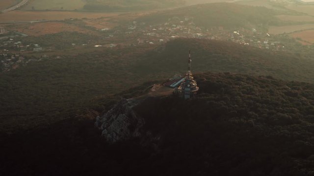 Aerial view of Zobor TV tower on hill at sunset