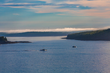Fototapeta na wymiar Fishing Boats in Misty Dawn