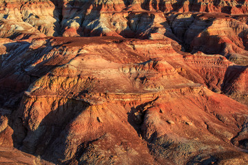 Rainbow City, Wucai Cheng. Colorful Red, Pink, Orange and Yellow landforms in the desert area of Fuyun County - Altay Perfecture, Xinjiang Province Uygur Autonomous Region, China. Rainbow Mountains