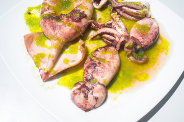 Griddle cuttlefish seasoned with green parsley sauce