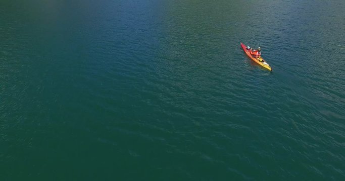 Man in kayak navigating the Tagua Tagua lake and its surroundings on a sunny day