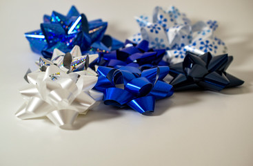 Blue, Silver, and white gift bows on white background