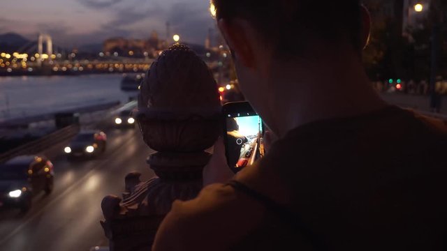 Taking photo with a smartphone at dusk