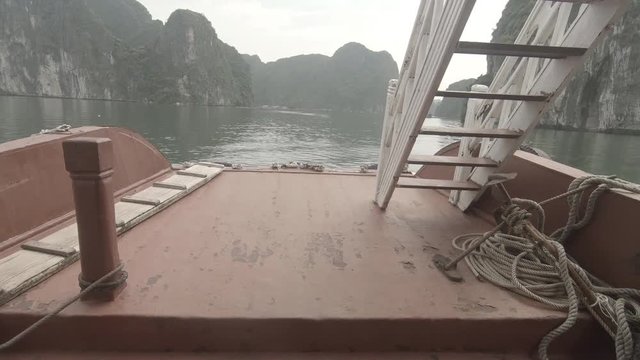 Walking on a boat to the end while doing a tilt up move with the camera