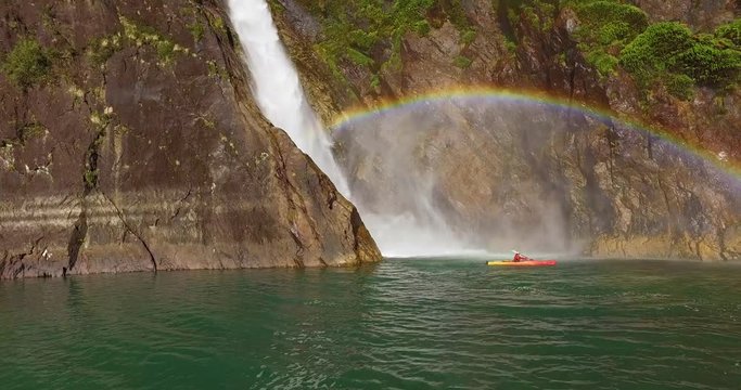 Man in kayak navigating the Tagua Tagua lake and its surroundings on a sunny day