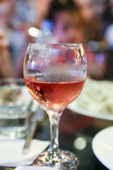 glass of white wine on wooden table