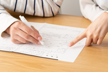 young asian couple writing marriage registration