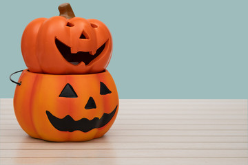 Halloween pumpkin on blue background. Halloween idea concept