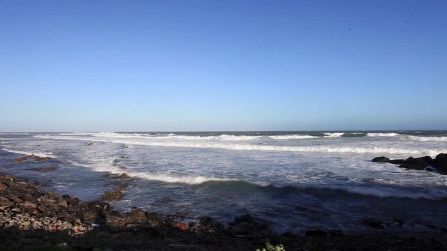Waves crashing against rocks in Gonubie, South Africa.