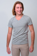 Obraz premium Young handsome man with long blond hair