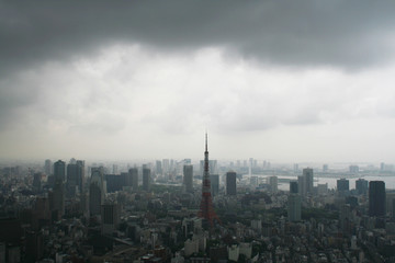 Downtown Tokyo skyline seen from Roppongi Hills before a storm.