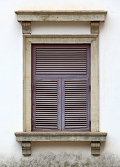 Close up of Portuguese era building facade with Corinthian style window of 17th century in Old Goa, India