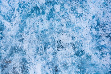 Fototapeta na wymiar The texture of the ice. The frozen water.Winter background 