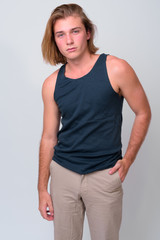 Fototapeta premium Young handsome man with long blond hair