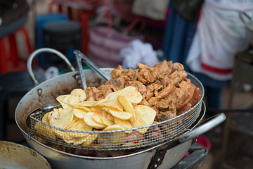 Traditional Peruvian food (meet and potatoes)  sold in a street market. Peru