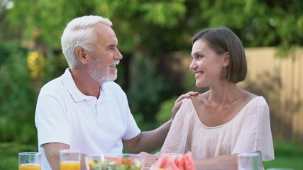 Sincere talk of father with grown up daughter, emotional embrace, memories