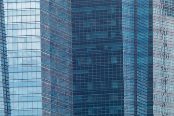 Fototapeta premium Exterior windows of tall office buildings in city