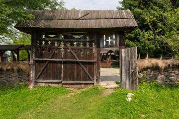 Fototapeta na wymiar Traditional Wood Gate in Maramures Region in Northern Romania.
