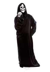 Halloween costume of a skeleton grim reaper wearing a black robe on a white background gesturing...