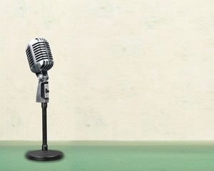 Retro style microphone on  background