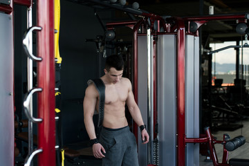 Young Man Standing In The Gym With Strap