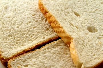 bread background / Bread is a staple food prepared from a dough of flour and water, usually by baking.