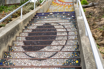 San Francisco, CA, USA - 09/14/2018: The 16th Avenue Tiled Step Folk Art Project in San Francisco. The 16th Avenue Tile Stairs Project is a community collaboration that creates a star-themed mosaic st